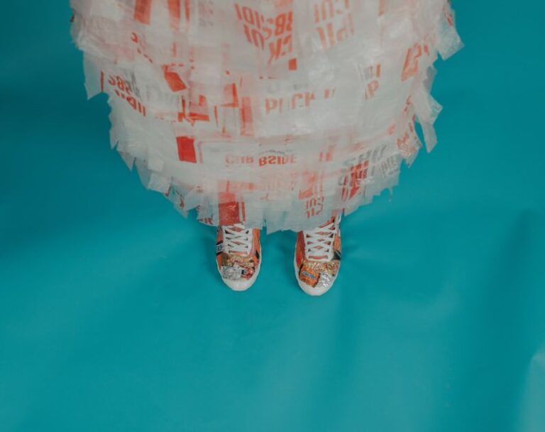 Recycled Materials - person wearing brown-and-white lace-up shoes
