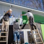 Residential Construction - three person climbing on ladder