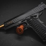 Defense Industry - a close up of a gun on a black surface