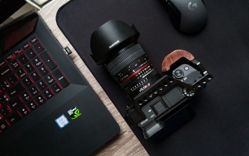 Consumer Electronics - black camera lens on black laptop computer