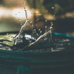 Water Scarcity - water drop on bucket photo