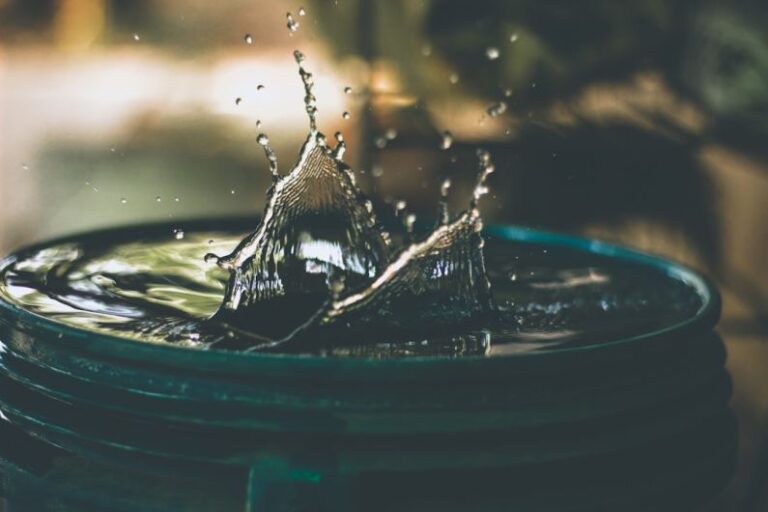 Water Scarcity - water drop on bucket photo