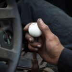 Automotive Requirements - person holding white ball