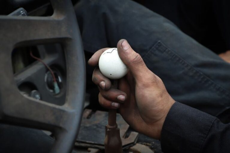 Automotive Requirements - person holding white ball