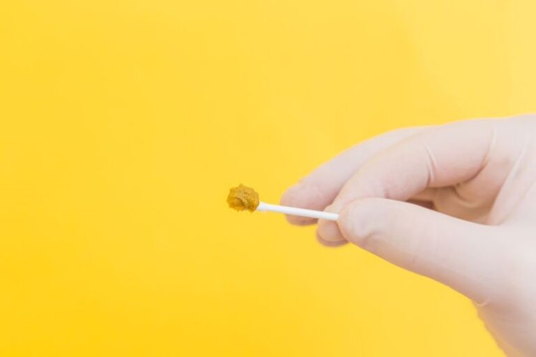 Tube Packaging - person holding white cotton buds
