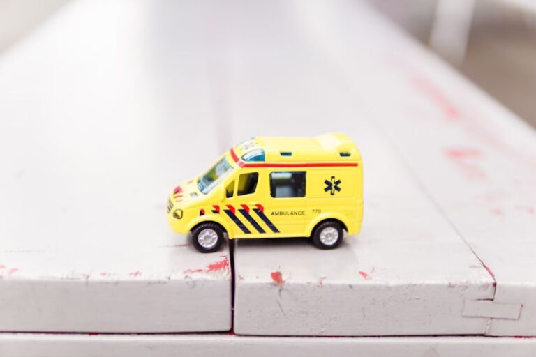Surface Treatment - yellow car toy on white surface