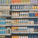 Automotive Market - a display in a grocery store filled with lots of milk