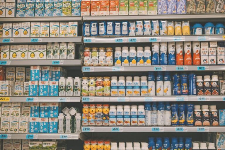 Automotive Market - a display in a grocery store filled with lots of milk