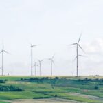 Environmental Compliance - windmill surrounded by grass during daytime