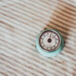 Laser Measurement - round teal gauge on white textile