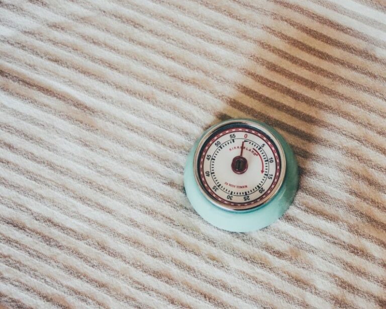 Laser Measurement - round teal gauge on white textile