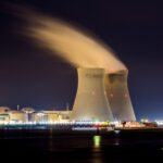Nuclear Power - city skyline with lights turned on during night time