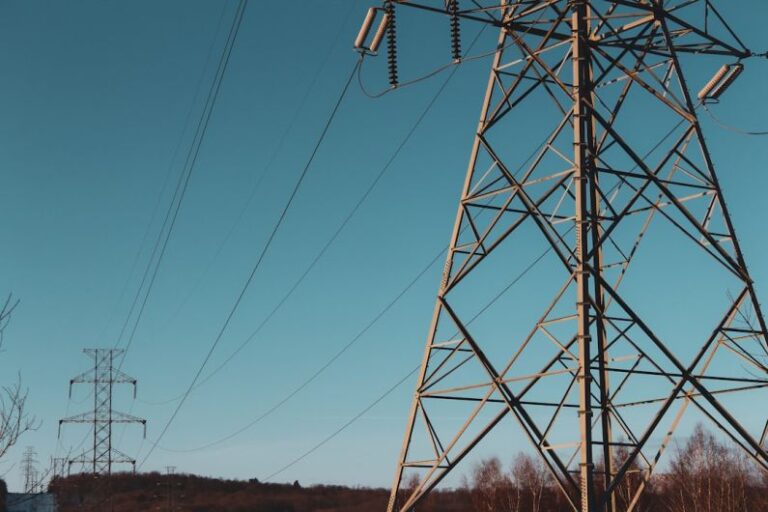 Telecommunications - brown electric post under blue sky during daytime