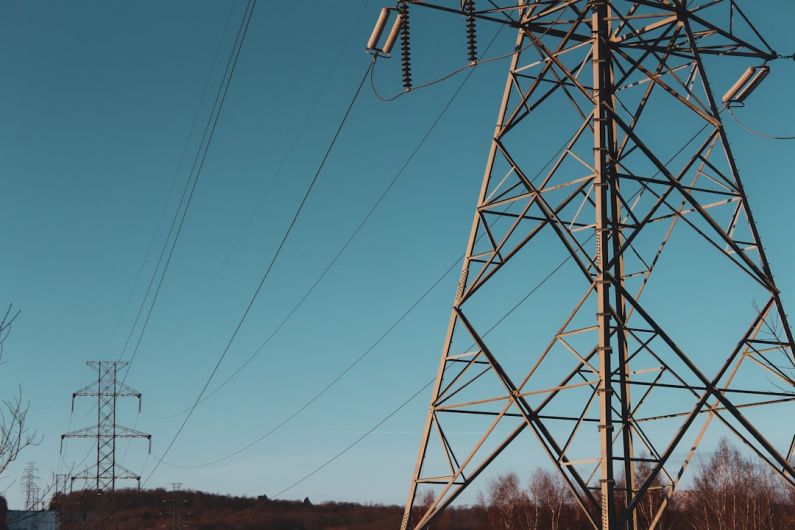 Telecommunications - brown electric post under blue sky during daytime
