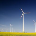 Sustainability Initiatives - windmills on grass field at daytime