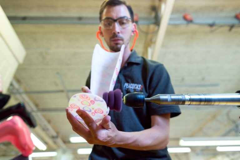 Forming Tools - man in black polo shirt holding pink and white floral ceramic mug