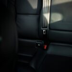 Safety Tips - black leather car seat with seat belt