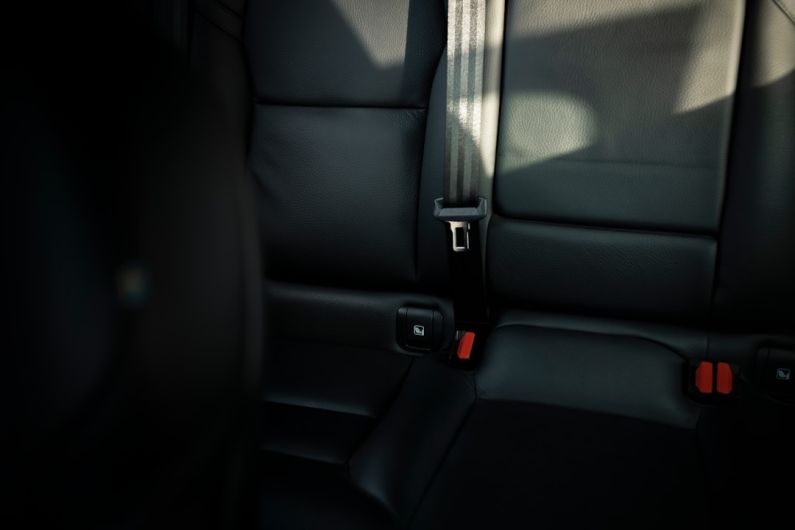 Safety Tips - black leather car seat with seat belt