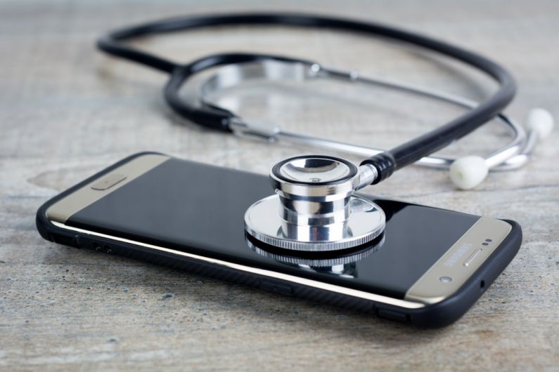 Troubleshooting - a smart phone with a stethoscope on top of it
