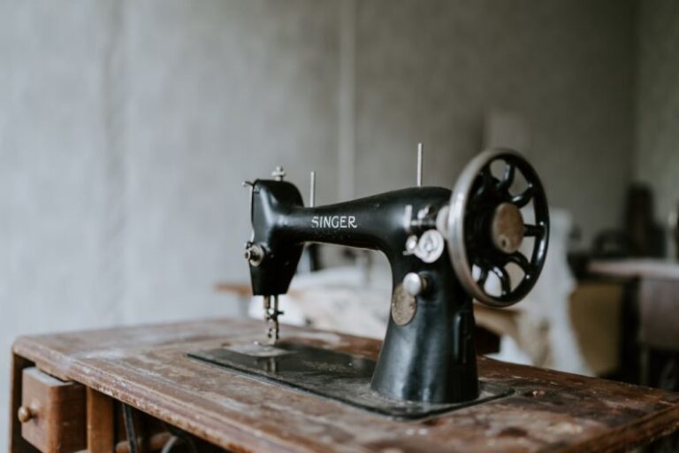 Deburring Machine - black sewing machine on brown wooden table
