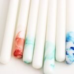 Tube Polishing - several white, blue, and red decorative taper candles