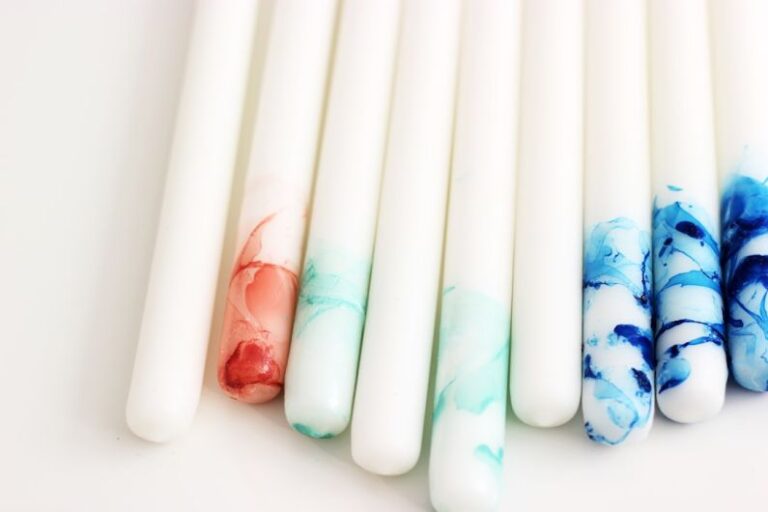 Tube Polishing - several white, blue, and red decorative taper candles