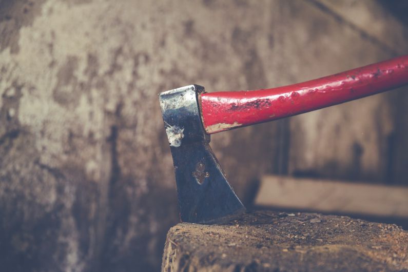Multi-material - red and black axe on wood slab