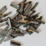 Hydraulic Press - closeup photo of clothespin lot on white surface