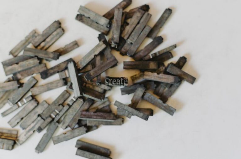 Hydraulic Press - closeup photo of clothespin lot on white surface