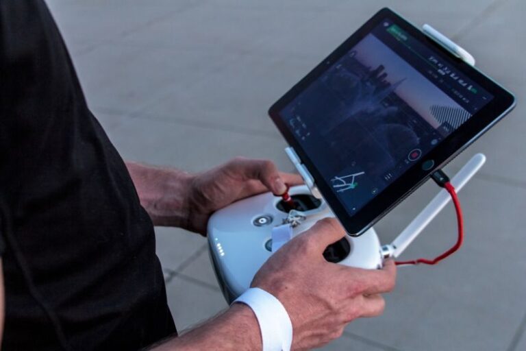 Wireless Monitoring - person holding quadcopter controller
