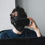 AI Defect Detection - man in blue crew neck shirt wearing black vr goggles