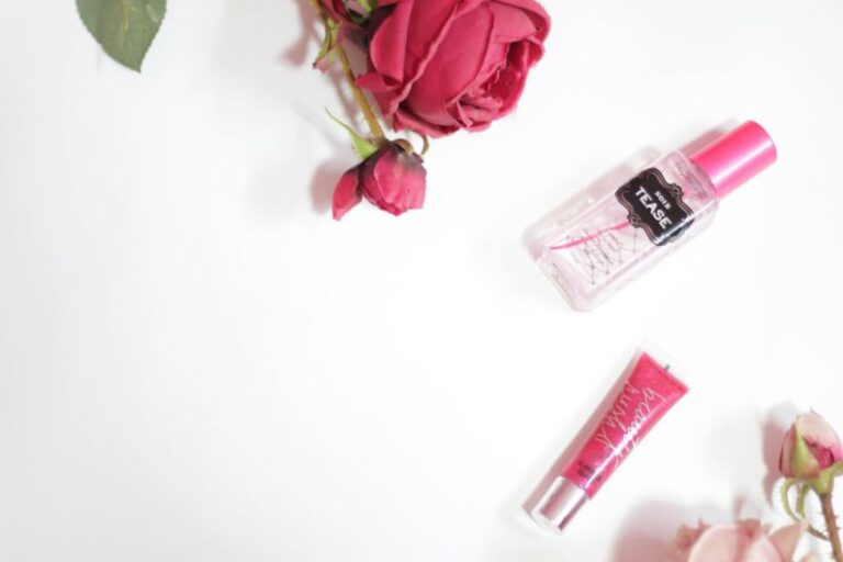 Tube Polishing - red rose beside clear perfume bottle