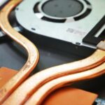Cooling Technologies - a close up of a hard drive being removed from a computer